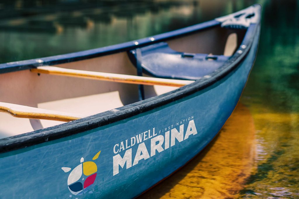 canoe with Caldwell First Nation Marina logo painted on the side