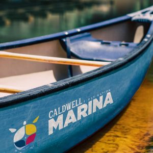 canoe with Caldwell First Nation Marina logo painted on the side